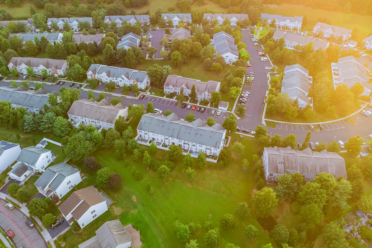 Aerial view of a suburban neighborhood showcasing real estate property opportunities in the US, ideal for Canadian investors.